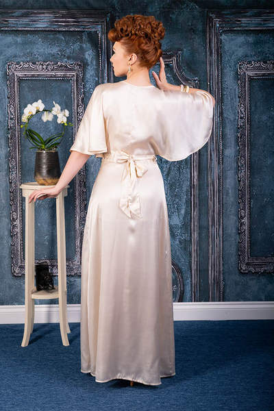 What Katie Did UK Vintage 1930s 1940s Satin wrap robe in a creamy peach color. Perfect old Hollywood glam look. Floor length soft silk. flowy sleeves. Curve hugging and flattering dressing gown. The proper Pinup